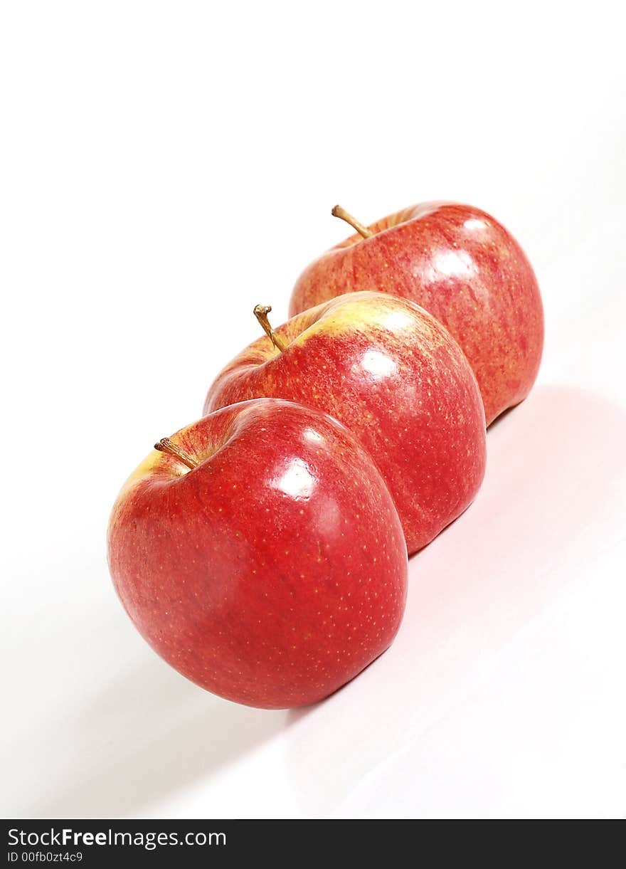 Three red apples