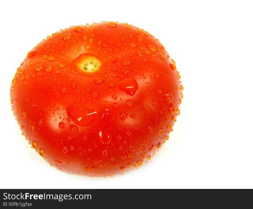 The big tomato isolated, on a white background. The big tomato isolated, on a white background.