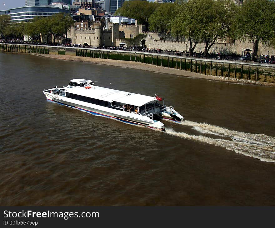 A view of some boats on the River Thames in London,you can also see the Tower of London. A view of some boats on the River Thames in London,you can also see the Tower of London.