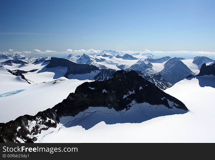 This is an image taken on the top of Galdh�piggen 2469 meters above sealevel. This is the highest mountain in Northern Europe. The Glacier in the front is called Svellnosbreen. This is an image taken on the top of Galdh�piggen 2469 meters above sealevel. This is the highest mountain in Northern Europe. The Glacier in the front is called Svellnosbreen.