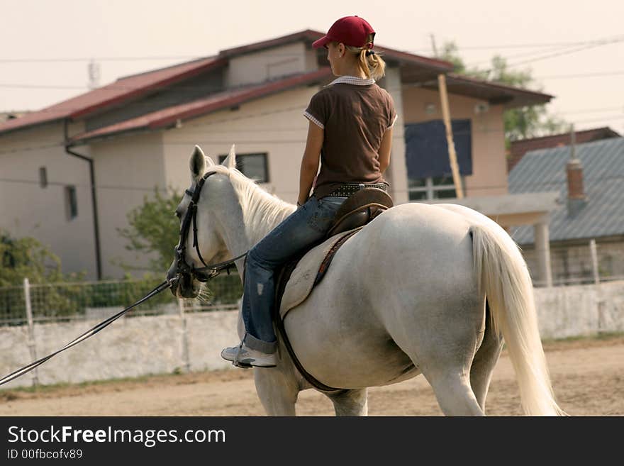 A cute girl and a horse