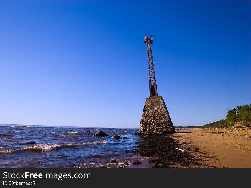 Old abandoned lighthouse already in the water