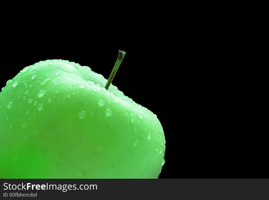 Granny smith apple isolated over a black background