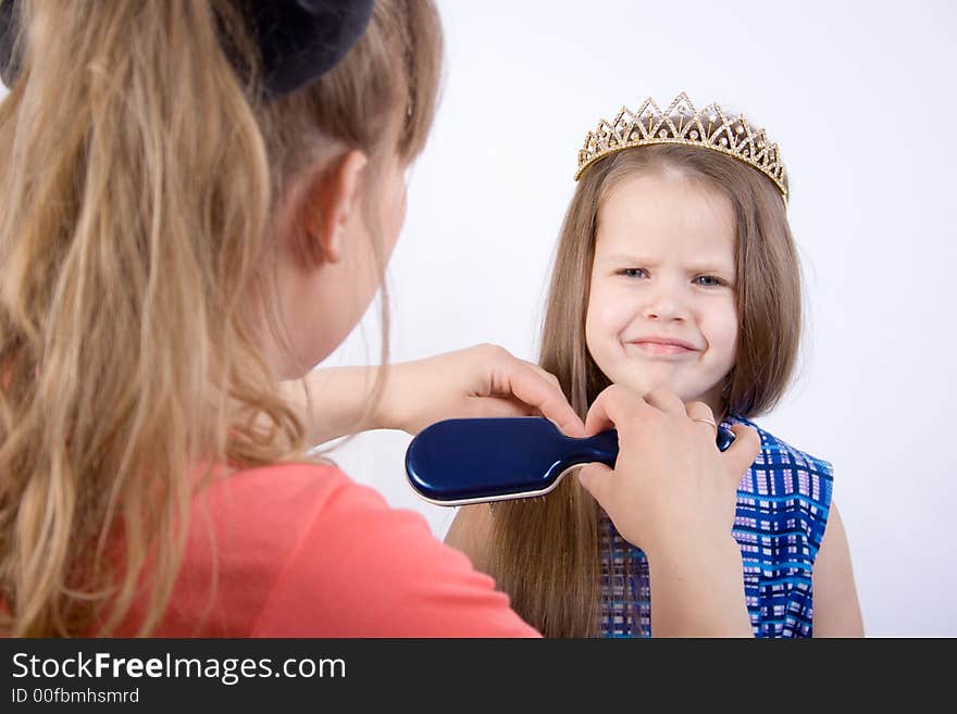 Mother preparing little girl for show. Mother preparing little girl for show