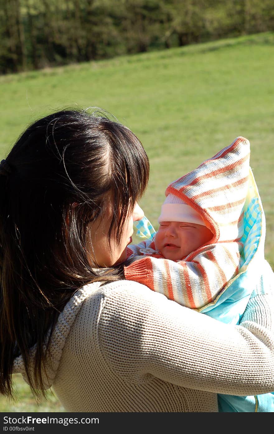 Mother and newborn baby on green meadow. Mother and newborn baby on green meadow