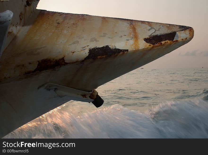 A million dollar sailboat yacht beached and shipwrecked along the coast of Florida in the Ocean. Here the front is shown close up. A million dollar sailboat yacht beached and shipwrecked along the coast of Florida in the Ocean. Here the front is shown close up.