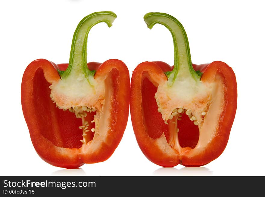 Red paprika sliced over white background