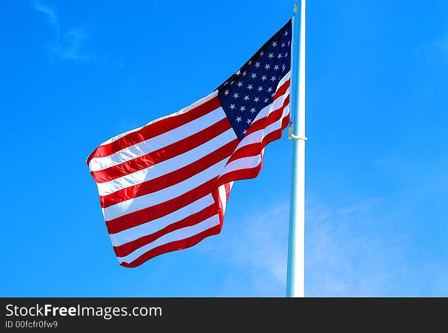 American flag blowing in the breeze. American flag blowing in the breeze.