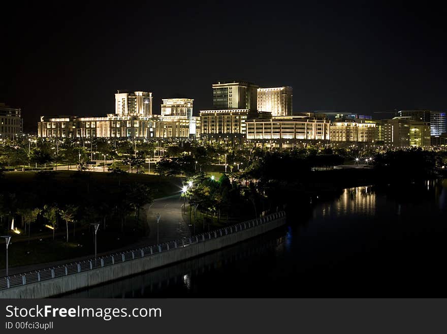 A night shot of brightly lit cluster of buildings