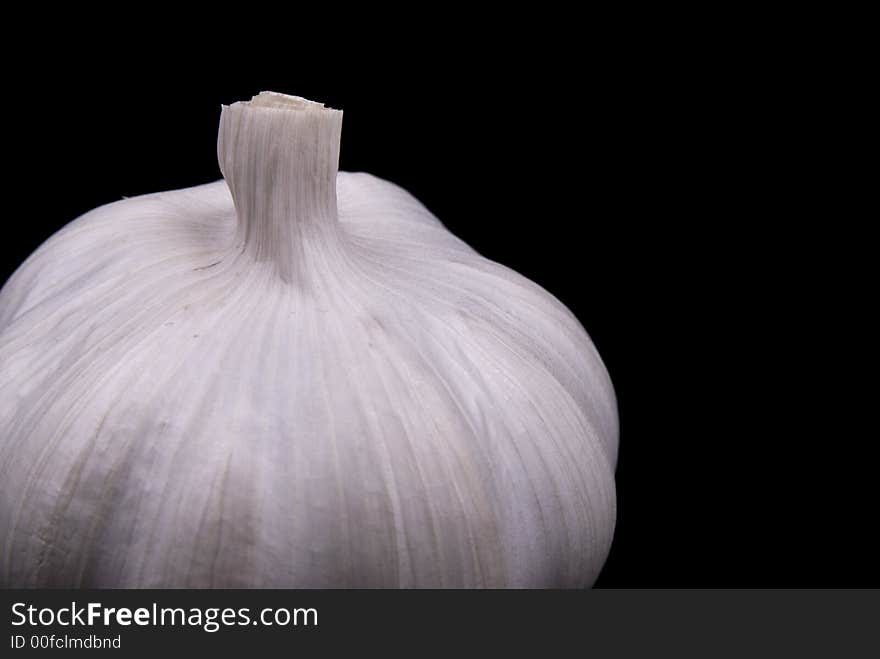 Close up view of Garlic on black background