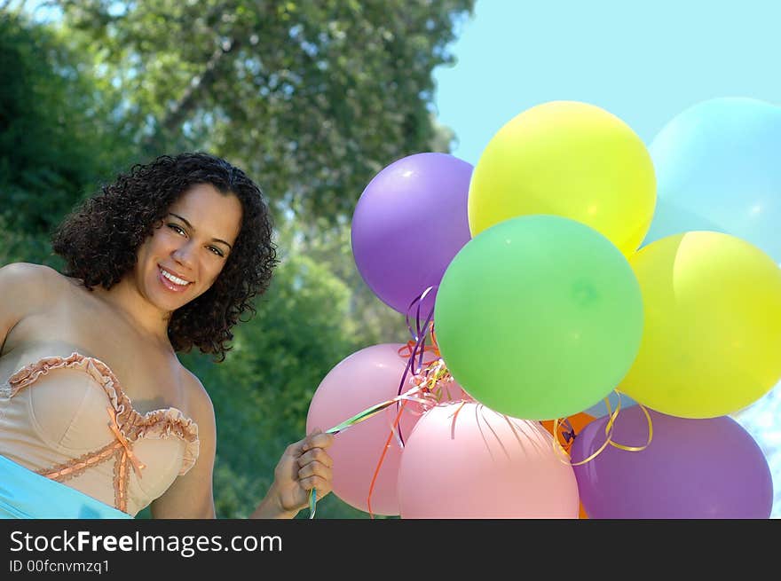 Beautiful birthday girl in a vintage dress with colorful baloons. Beautiful birthday girl in a vintage dress with colorful baloons