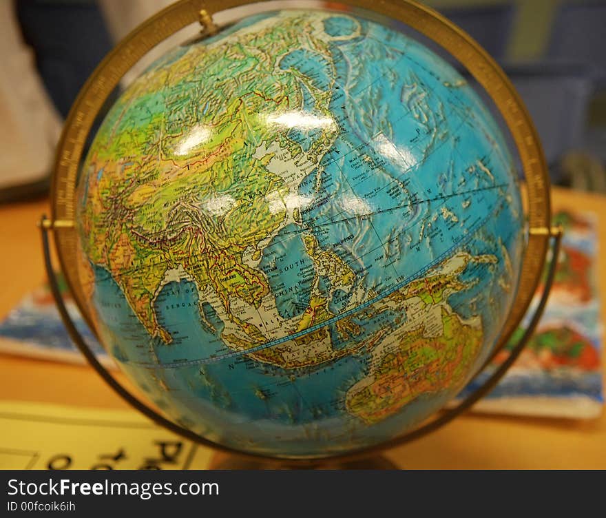 A globe inside the glass room