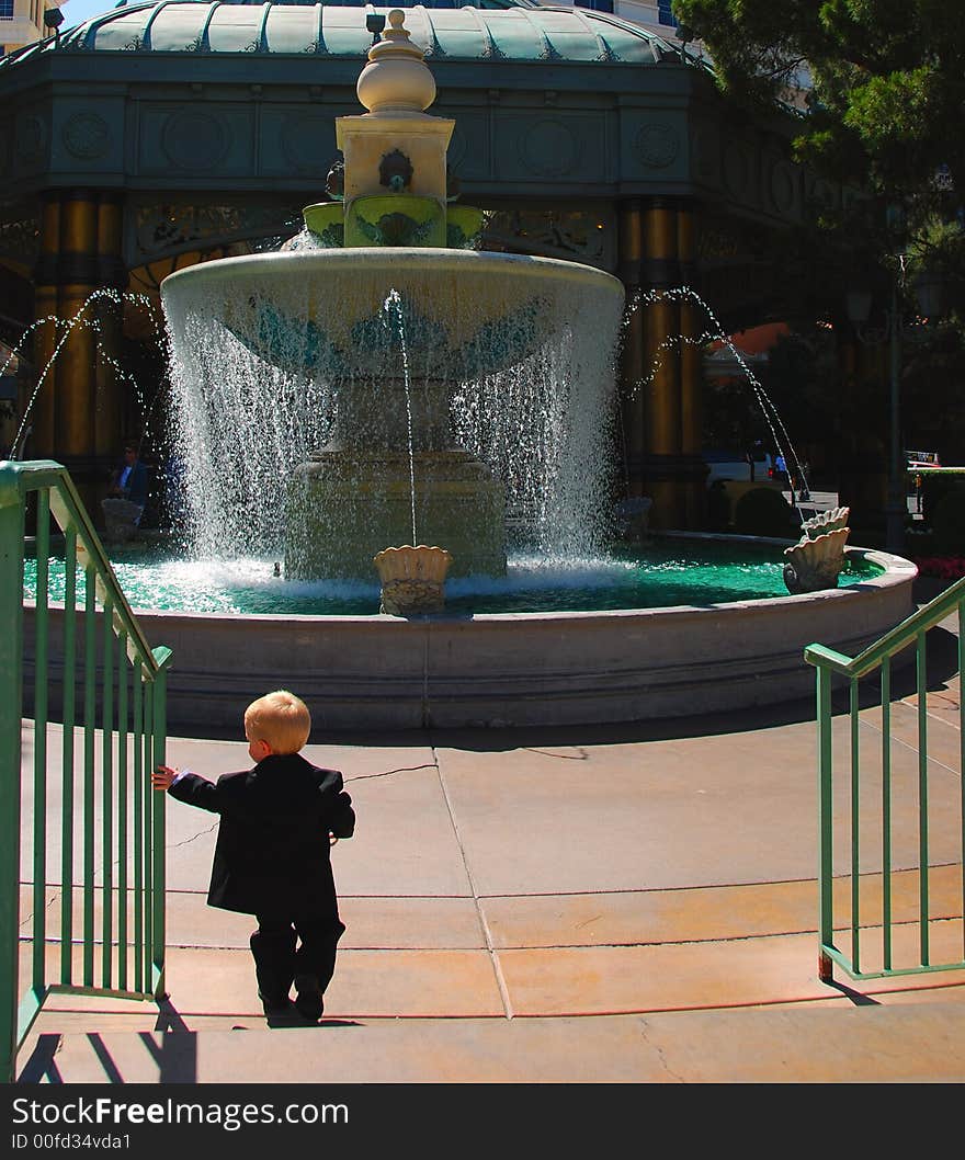 Little boy heading towards the fountain. Little boy heading towards the fountain