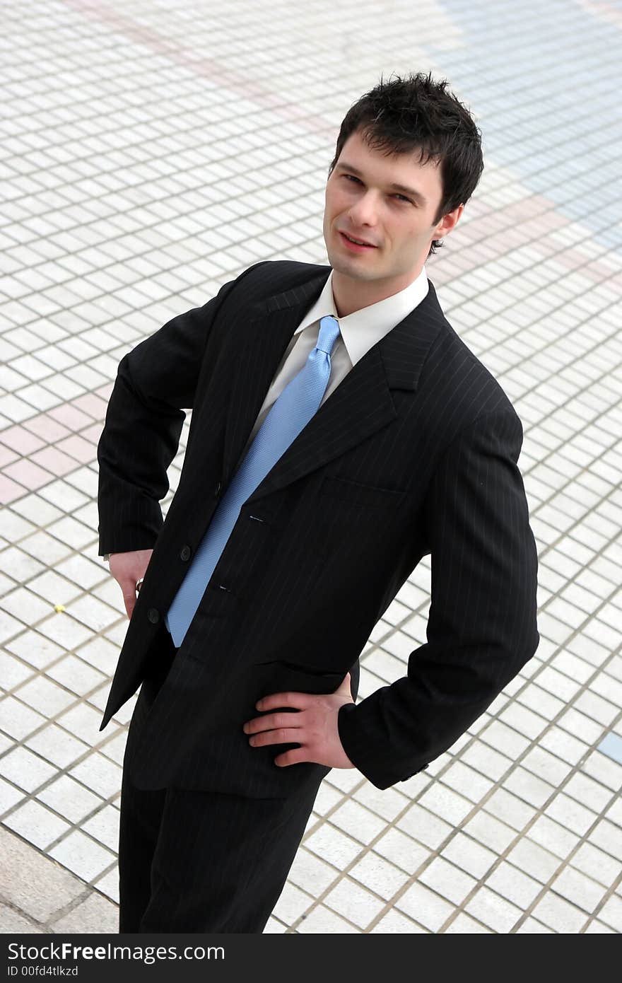 Confident young businessman in a suit and tie