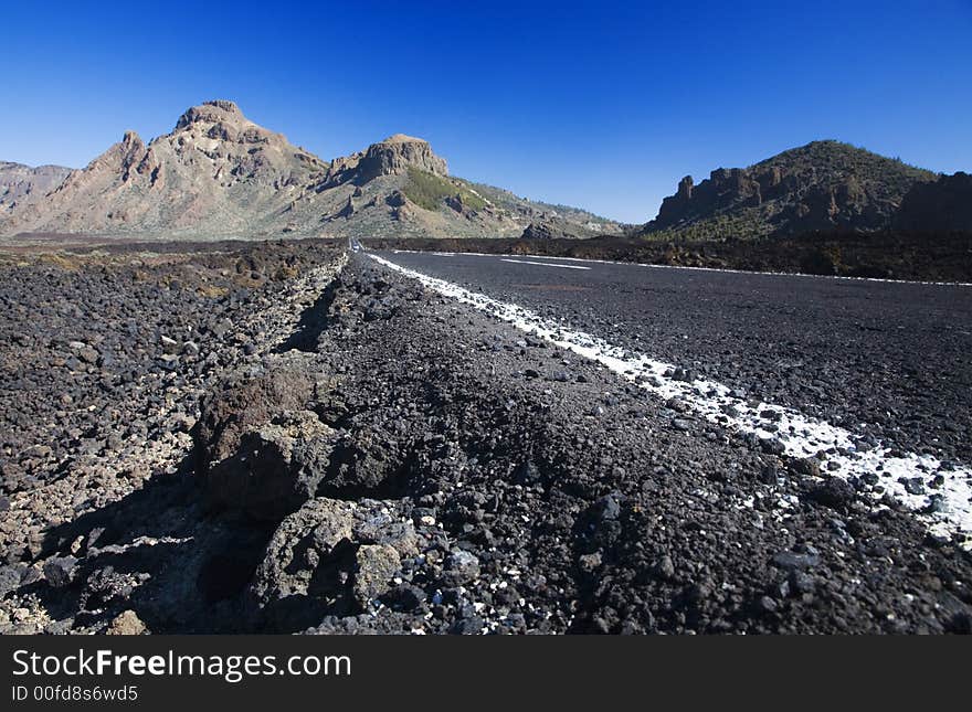 Road in lava landscape of the El Teide National Park, Tenerife, Canary Islands. Road in lava landscape of the El Teide National Park, Tenerife, Canary Islands