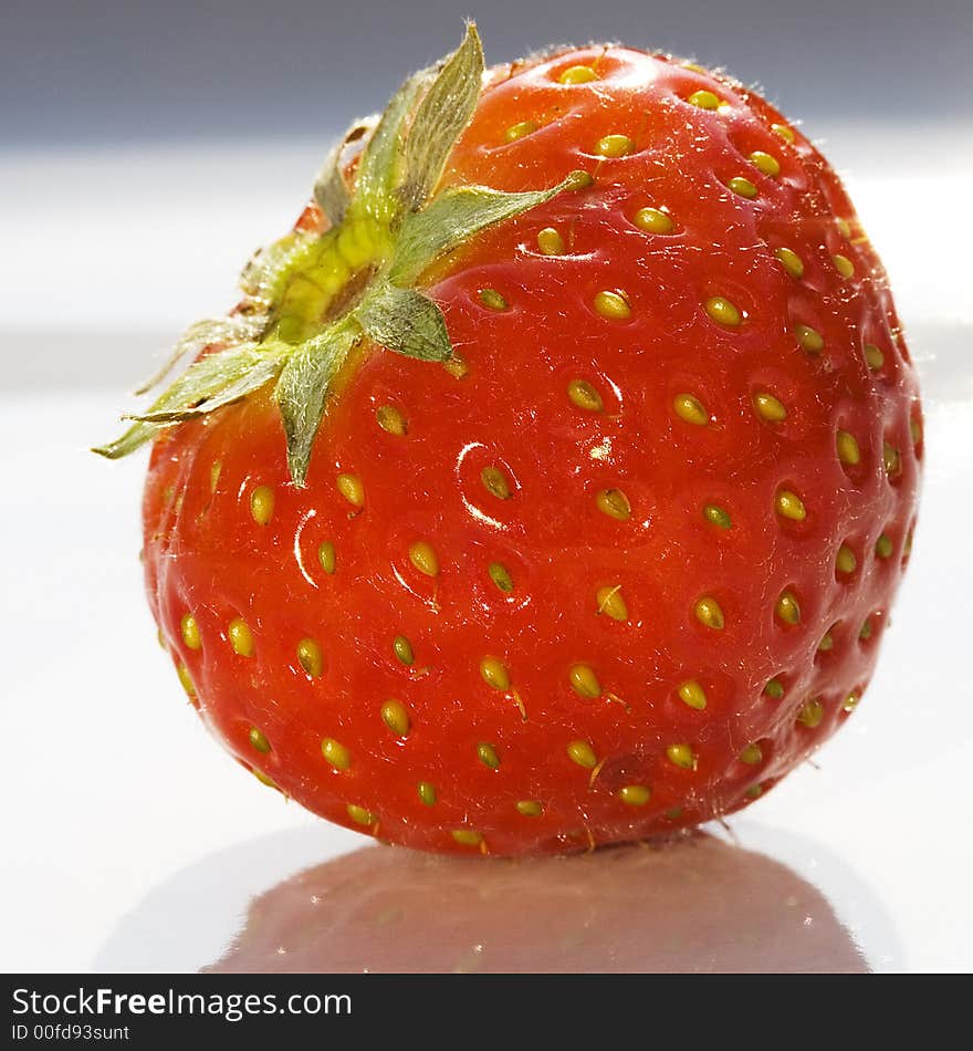 Macro close-up of a single strawberry