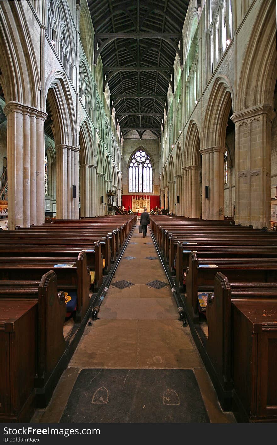 Interior of Bridlington Priory in UK -Vertical view with figure to give scale. Interior of Bridlington Priory in UK -Vertical view with figure to give scale