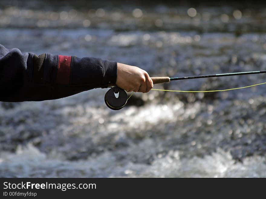 Fisher in river