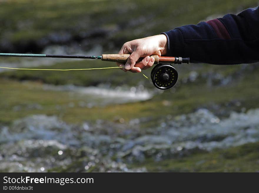 Fisher in river