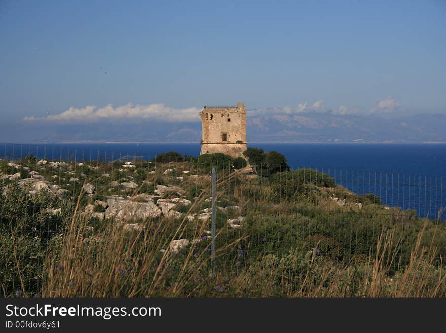 Hilltop Normand tower. Sea sky