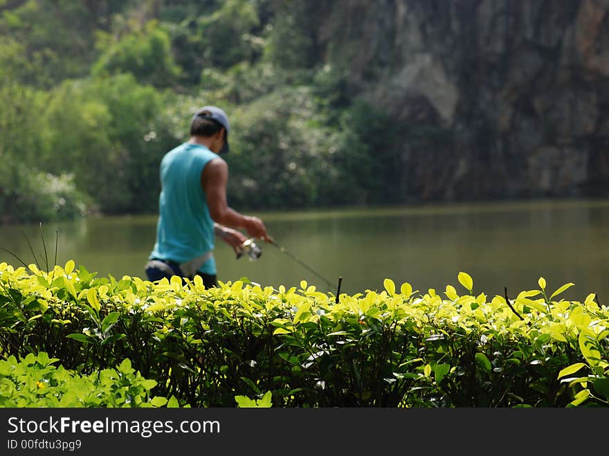 Teen Fishing In The Pond