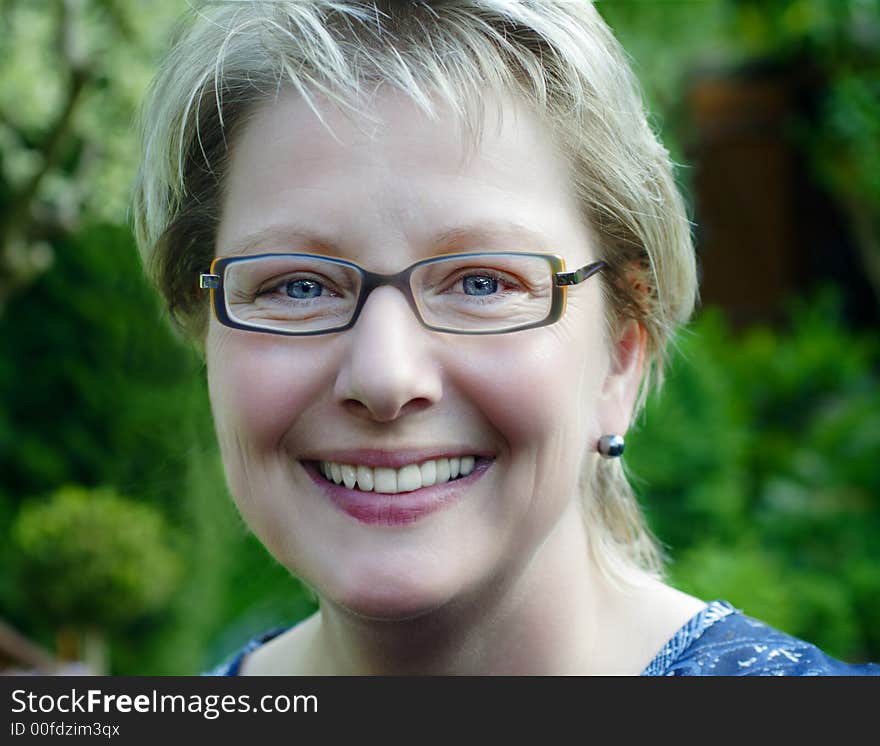 Blond woman with fashion eyeglasses