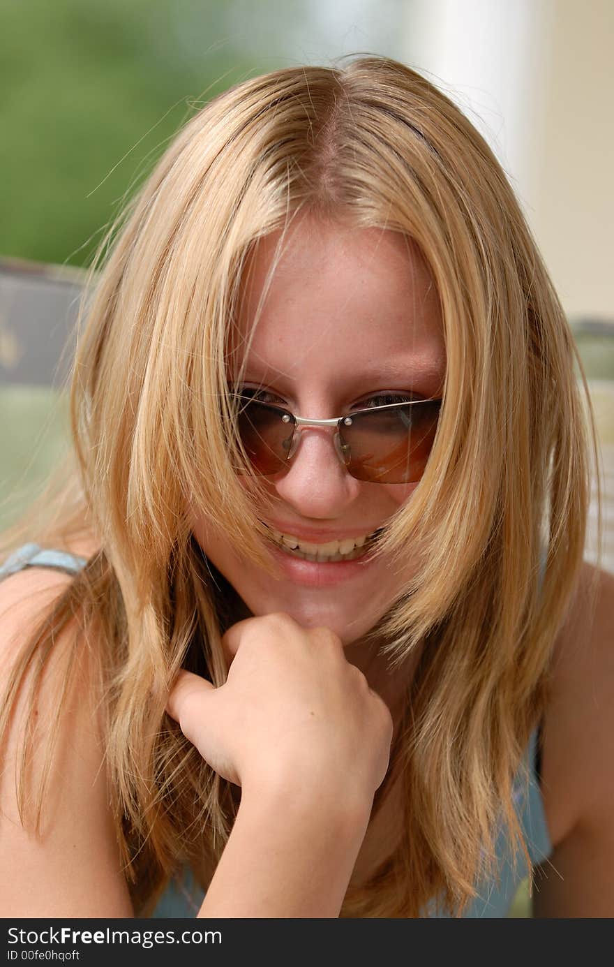 Young girl is laughing. Spring, south Germany. Young girl is laughing. Spring, south Germany.