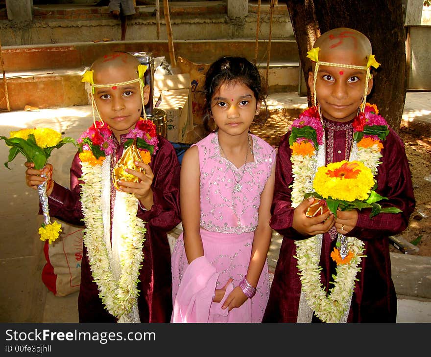 Brothers with their beloved sisters in a dress of an Indian monk after thread ceremony. Brothers with their beloved sisters in a dress of an Indian monk after thread ceremony.