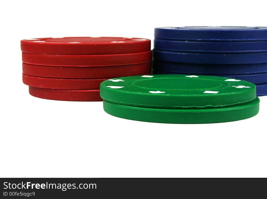 Stacks of poker chips isolated overwhite