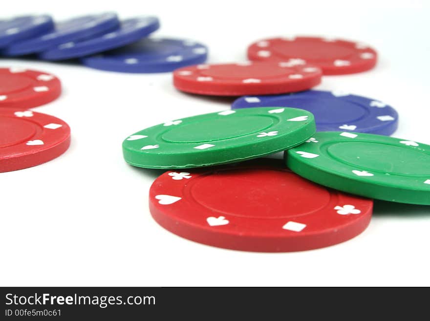 Stacks of poker chips isolated overwhite