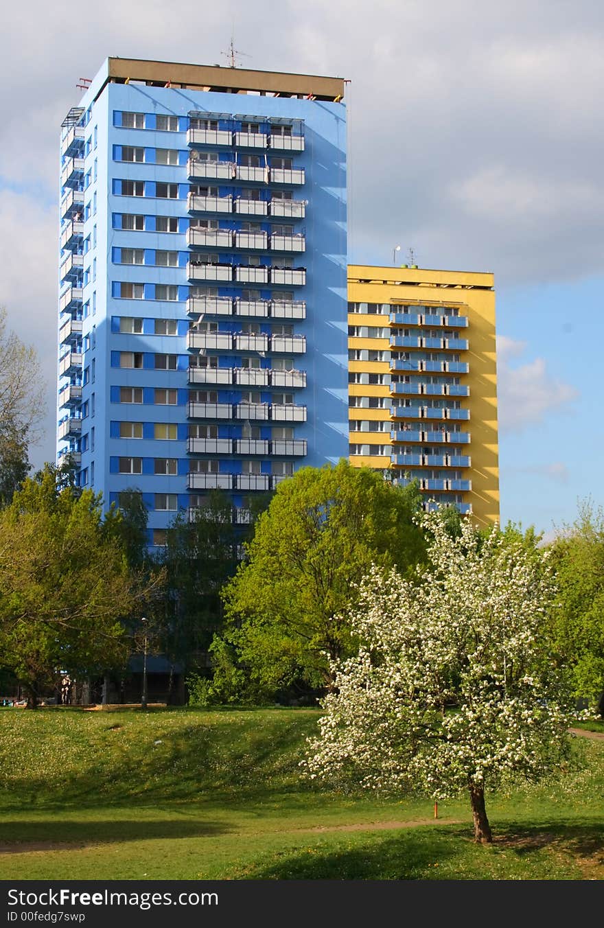 New buildings in park in blue and yellow colors