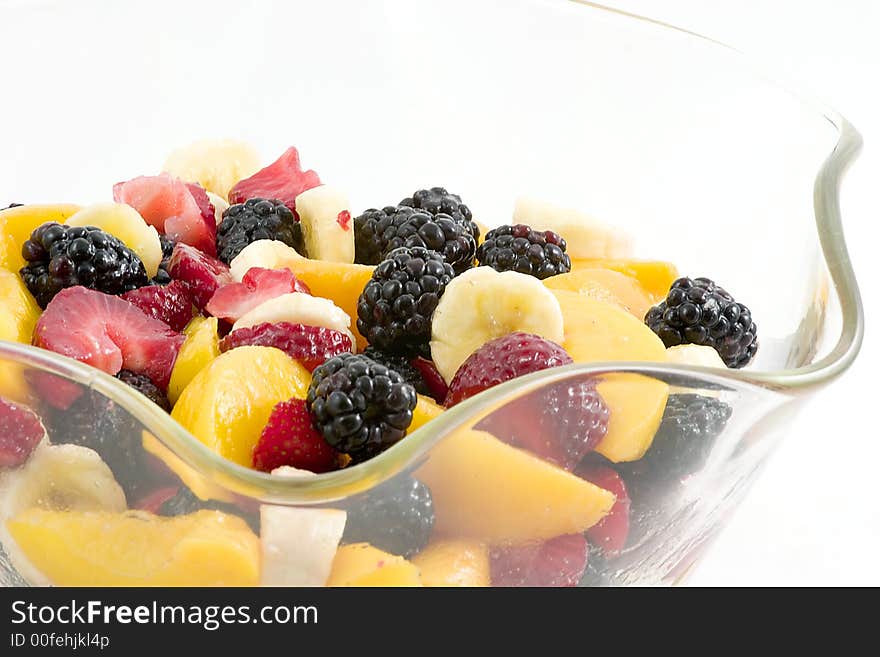 A beautiful clear glass bowl makes a wonderful home for sliced peaches, chunks of strawberries, slices of bananas and whole blackberries. A beautiful clear glass bowl makes a wonderful home for sliced peaches, chunks of strawberries, slices of bananas and whole blackberries.