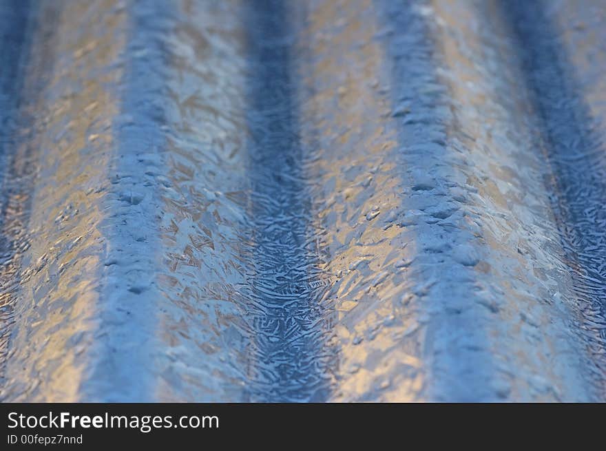 Corrugated roof makes an abstract background. Selective focus. Corrugated roof makes an abstract background. Selective focus.