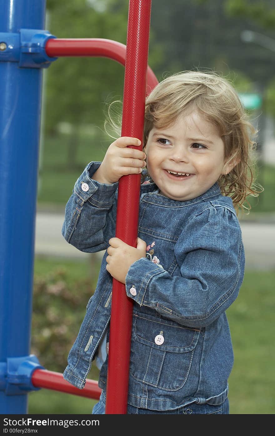 Young pretty girl smiling on playground