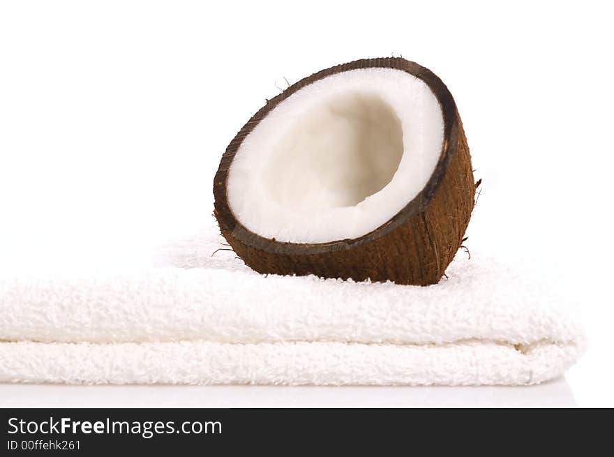 Coconut and white towel. exotic, tropical scene. beautyfarm. Coconut and white towel. exotic, tropical scene. beautyfarm