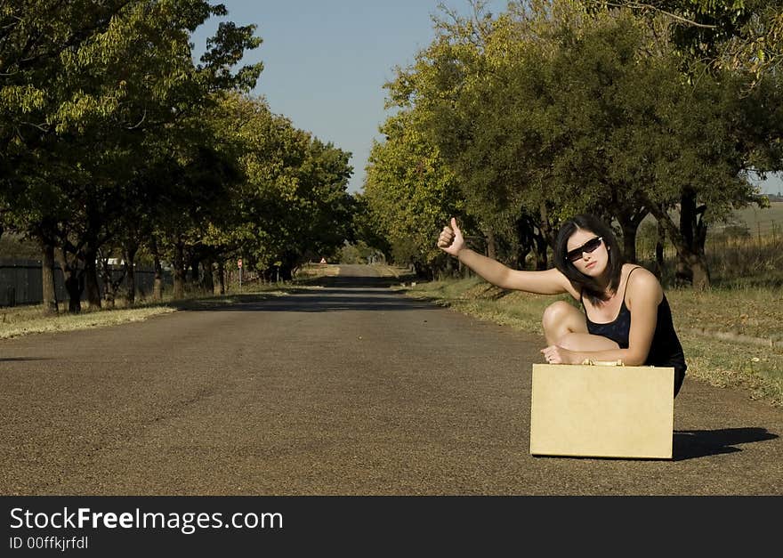 Sunglasses next to suitcase