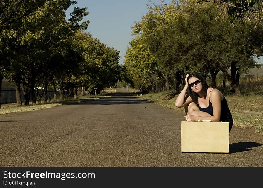 Sunglasses Next To Suitcase