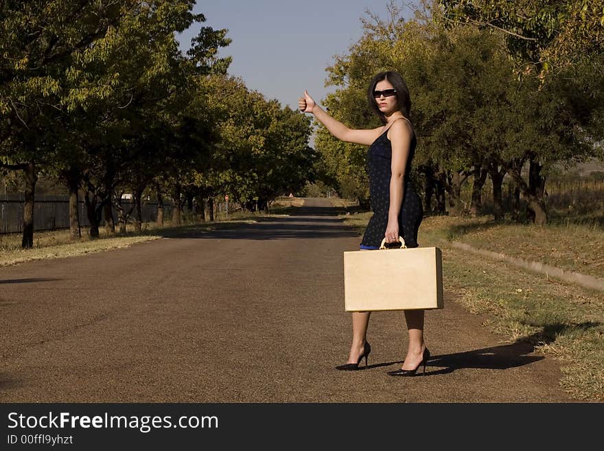 Sunglasses standing suitcase