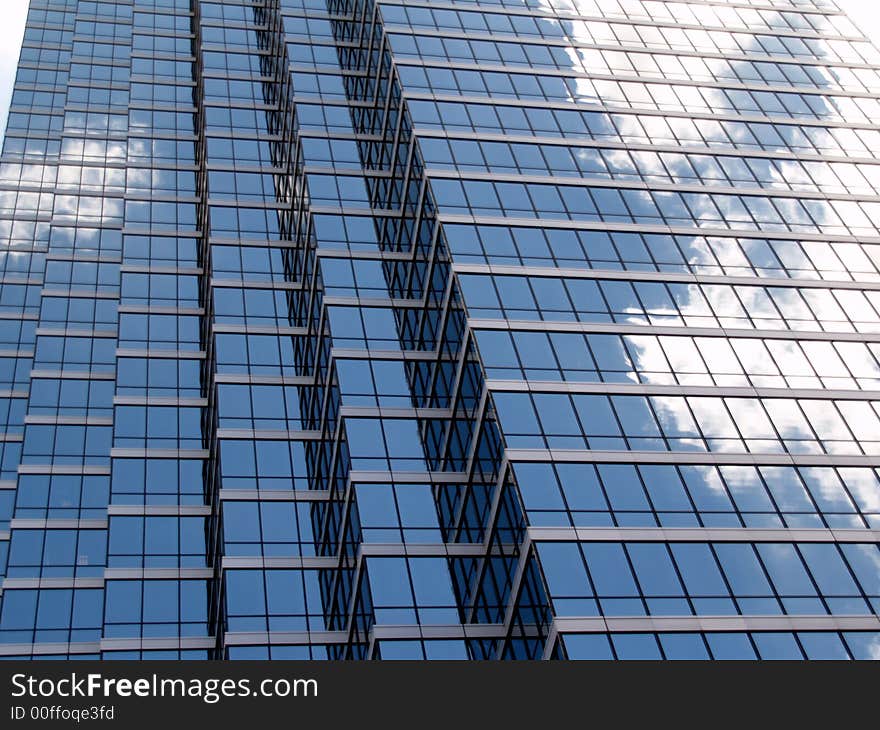 Beautiful reflections of the clouds in the glass bulidings of downtown Dallas. Beautiful reflections of the clouds in the glass bulidings of downtown Dallas