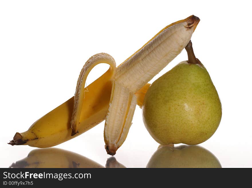 Ripe banana and pear on a white background