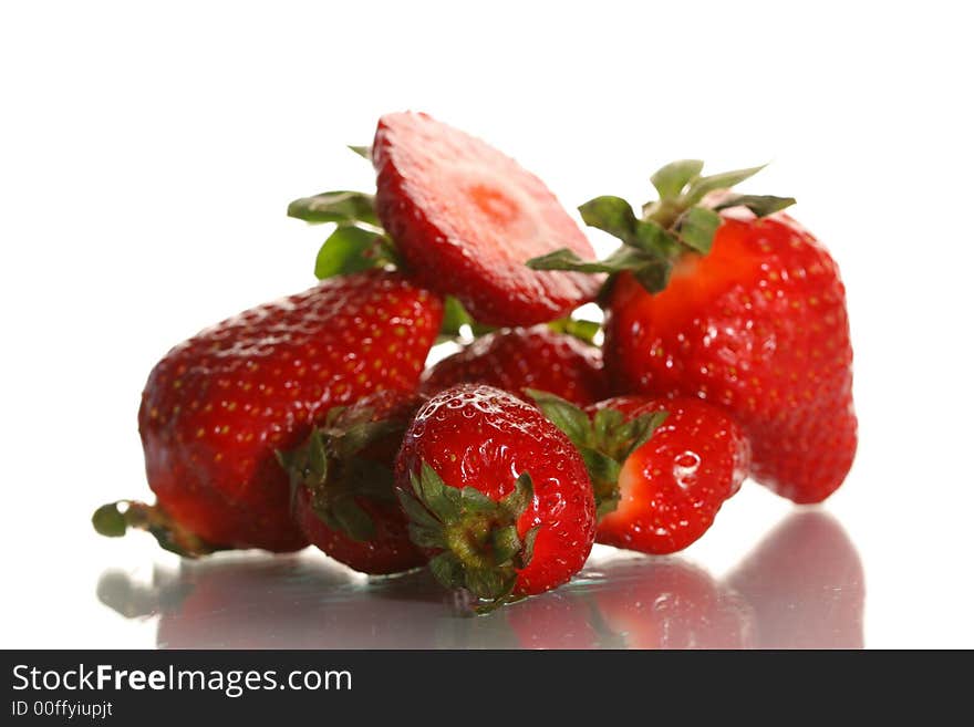 Ripe juicy strawberry on a white background