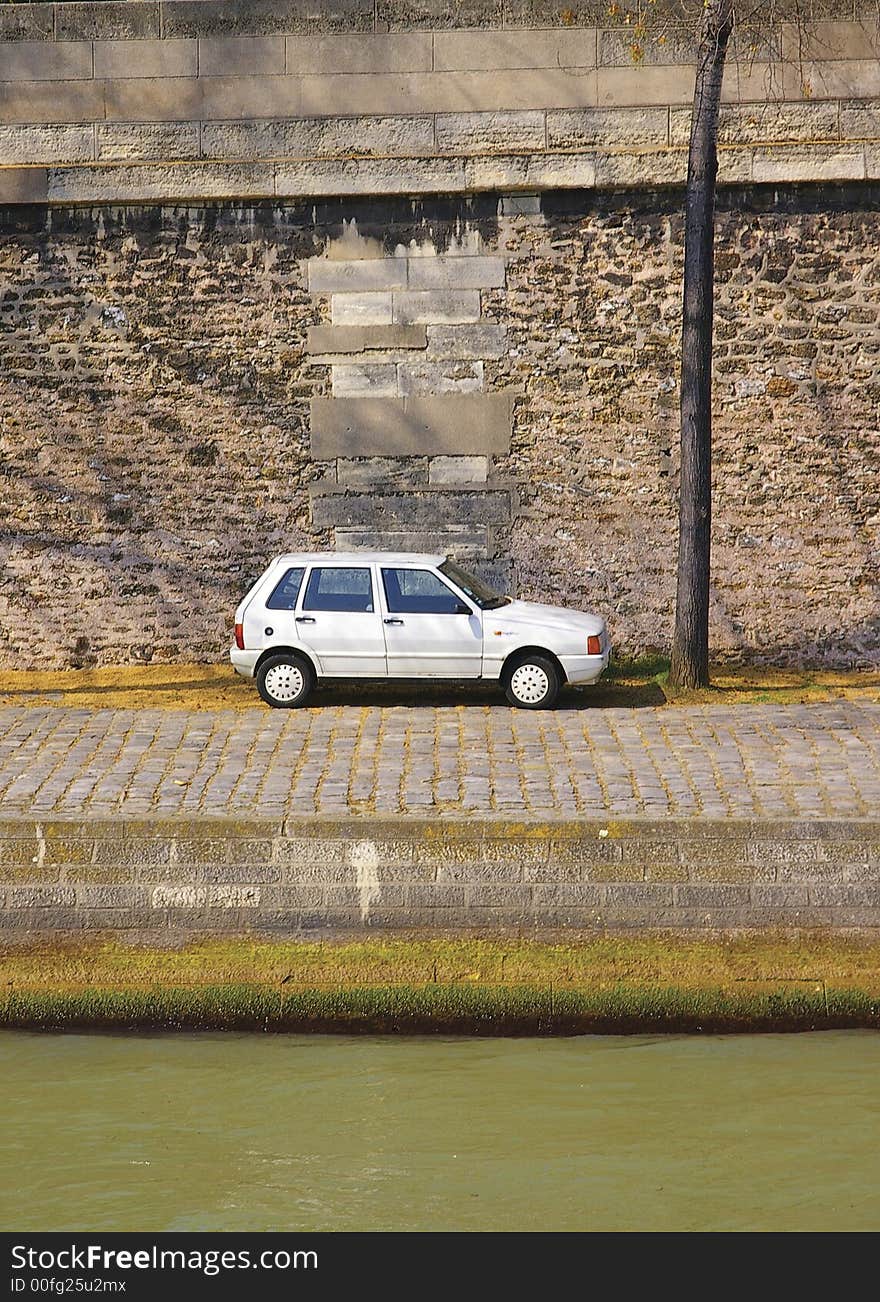 Lone car on Paris quay from the left bank of Seine