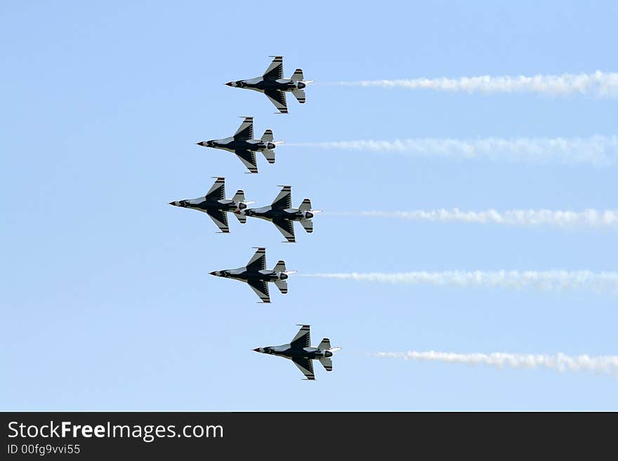 A fighter formation at a air show. A fighter formation at a air show