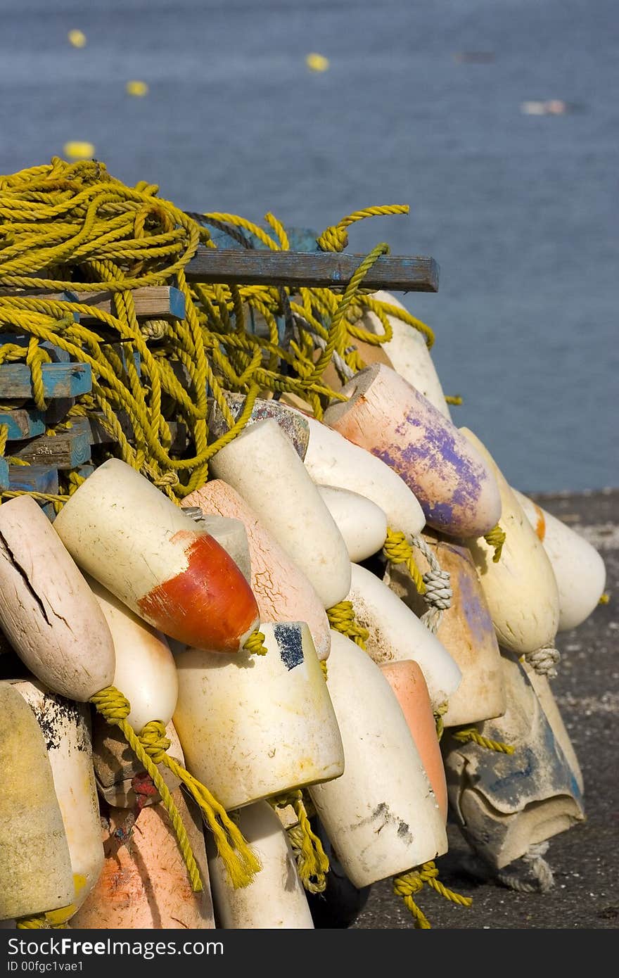 Buoys and yellow rope on  the beach