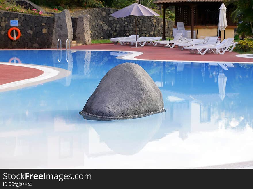 The blue water pool in the resort garden