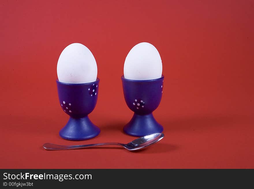 Two white egg on red background. Two white egg on red background