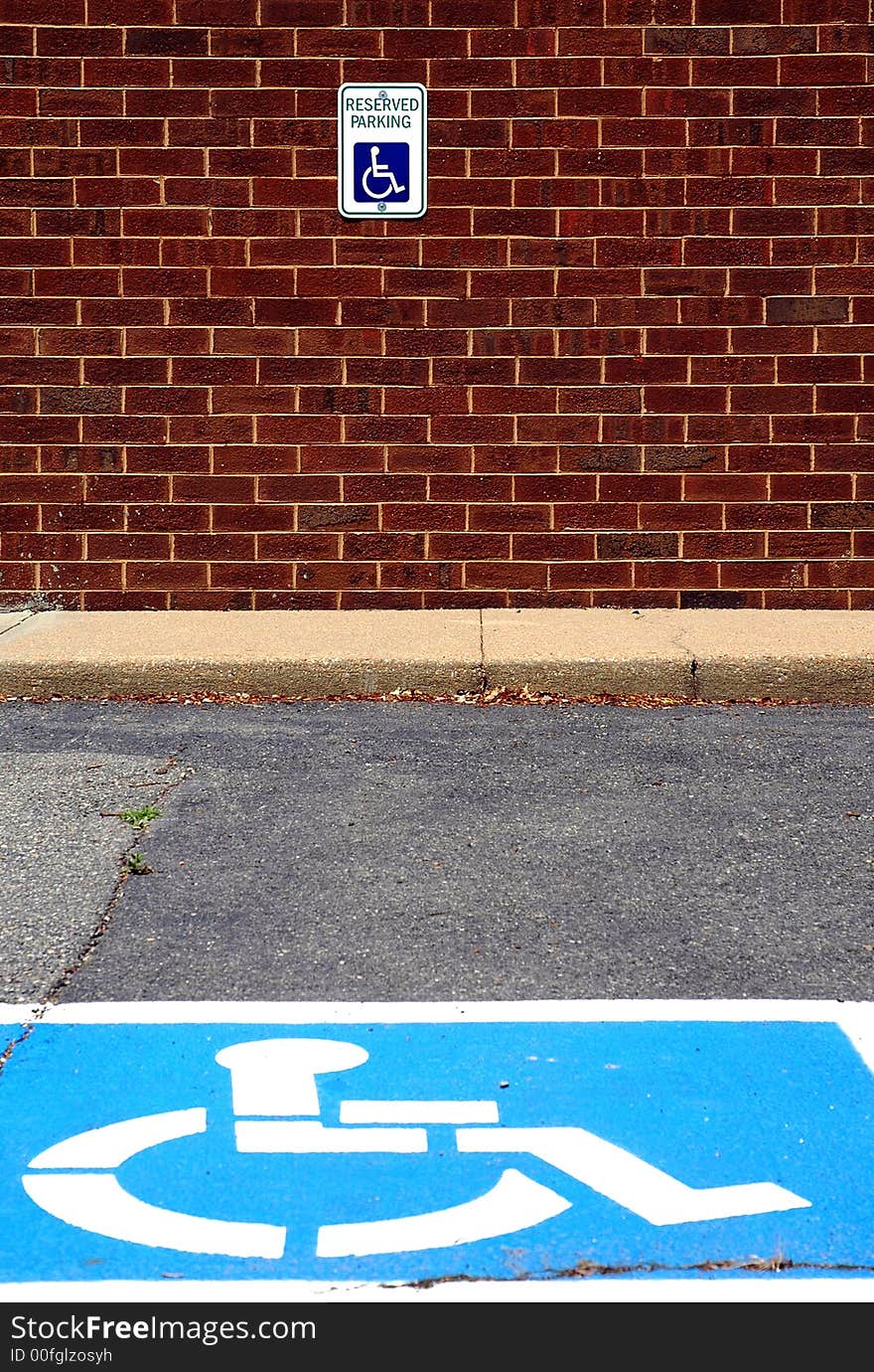 I composed this photograph during a bright day so the blue symbol on the concrete and the red in the brick wall would stand out. I composed this photograph during a bright day so the blue symbol on the concrete and the red in the brick wall would stand out.