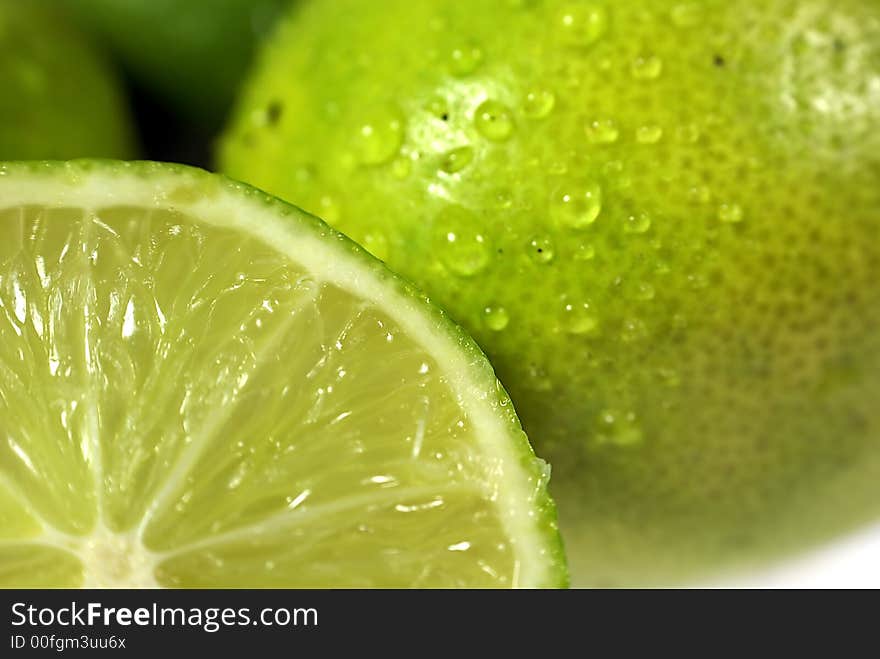 Lime with water drops on white background. Lime with water drops on white background