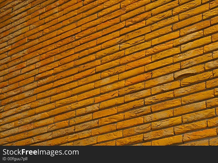 Brick wall painted in yellow. Brick wall painted in yellow