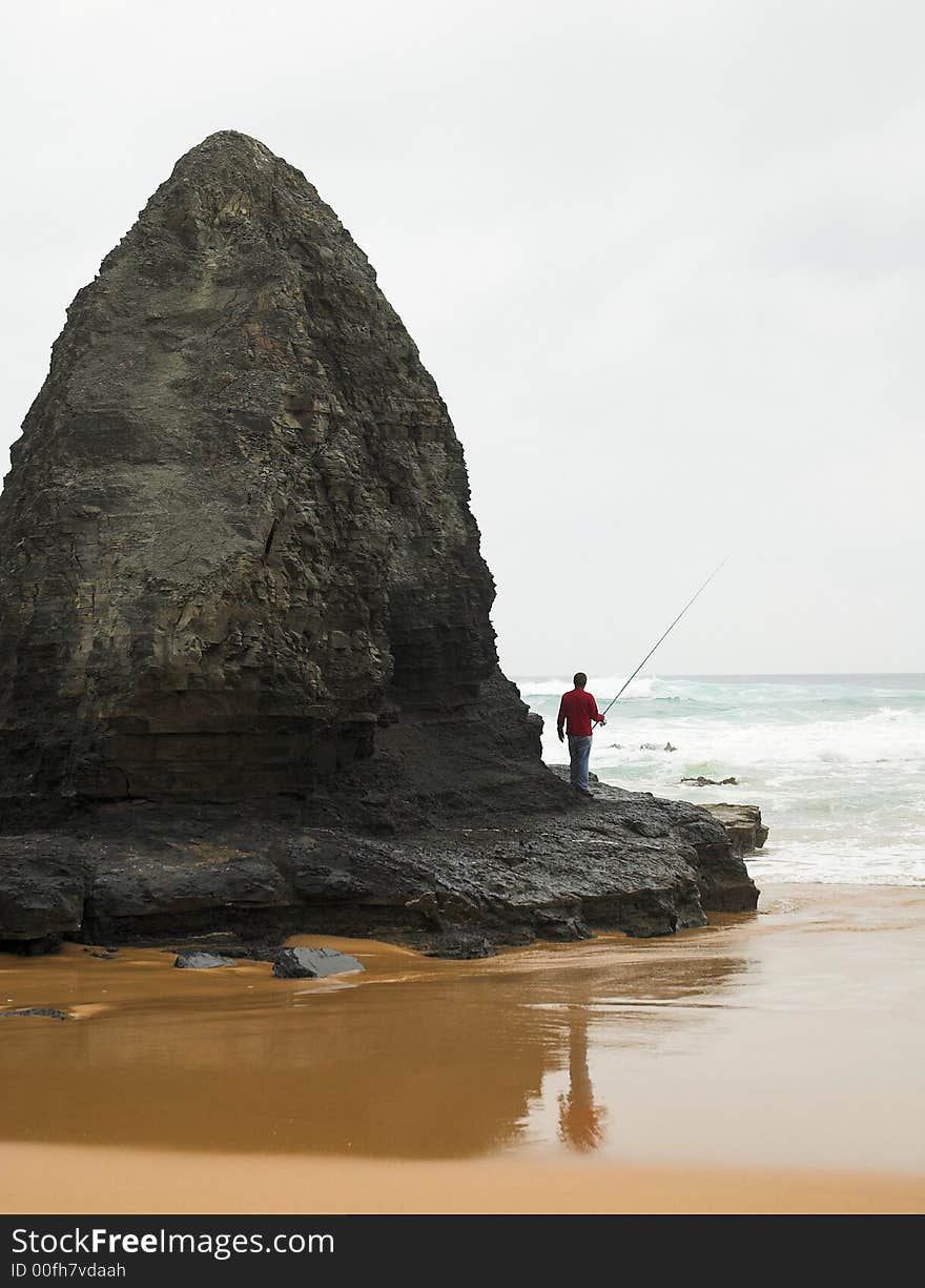 Man fishing on a beach